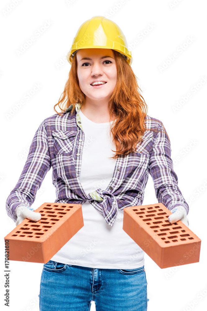 woman in helmet gives red bricks, portrait on white background woman in helmet gives red bricks, portrait on white background