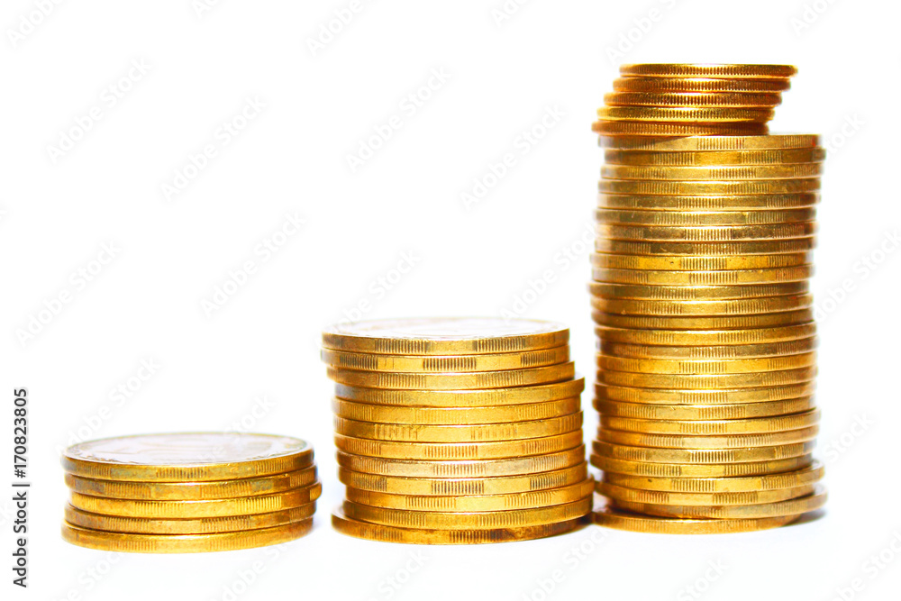 Stacks of golden coins isolated on a white background Stacks of golden coins isolated on a white background