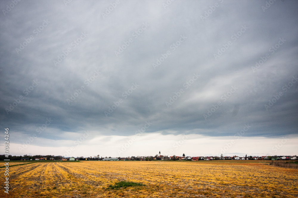 Cloudy skies over empty fields in Gorcko, Slovenia. Cloudy skies over empty fields in Gorcko, Slovenia.