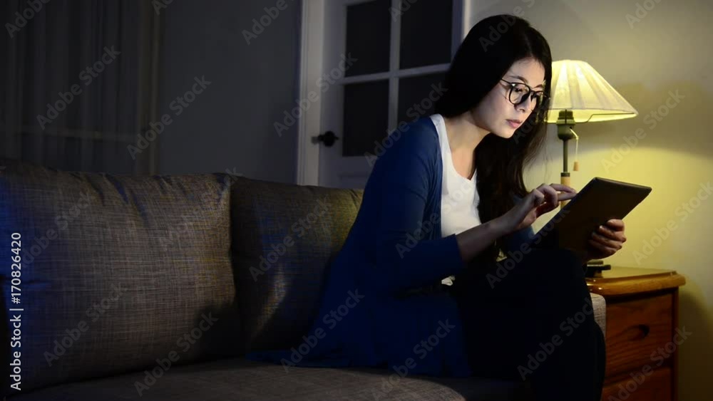 seriously woman watching digital tablet screen seriously woman watching digital tablet screen