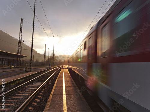 Beautiful sunset at empty countryside train station.