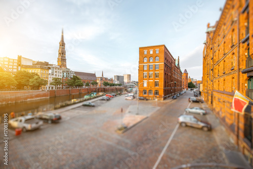 Sunset view on the old town with saint Catherines church and Hafen district with warehouses in Hamburg city, Germany