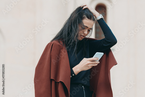 stylish woman using smartphone