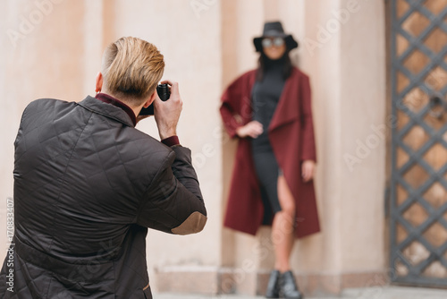 man taking photo of girlfriend