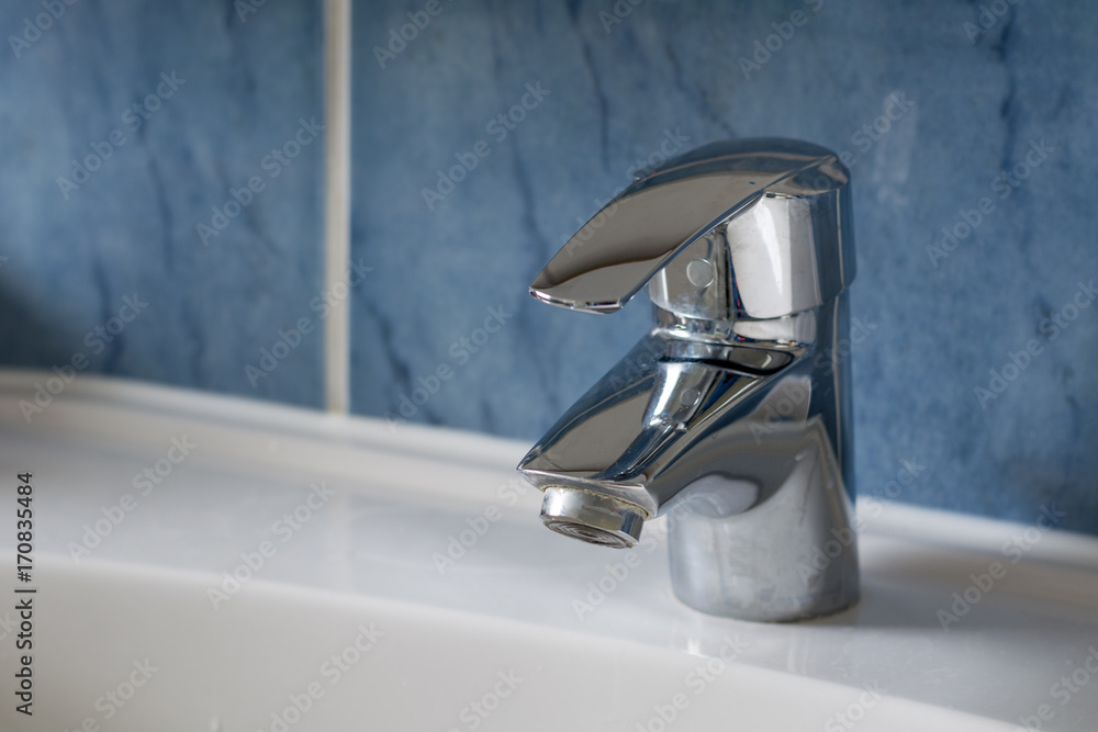 Water tap in the bathroom from the side Water tap in the bathroom from the side
