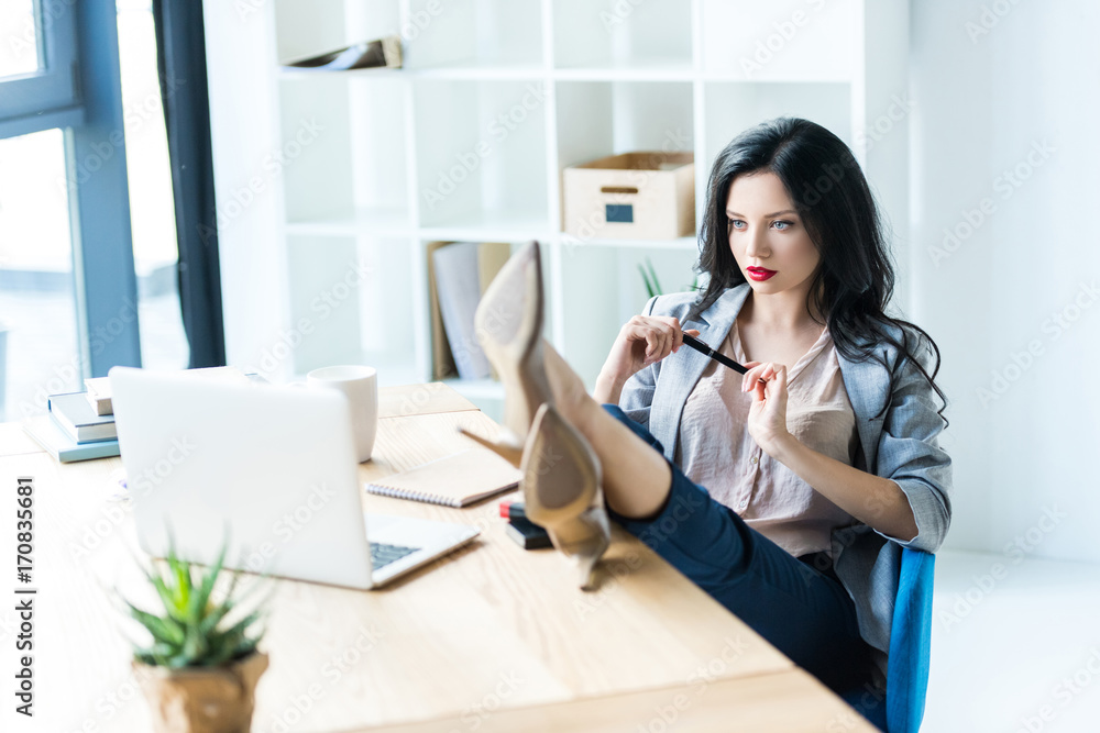 businesswoman at workplace with laptop businesswoman at workplace with laptop