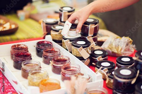 Obraz na plátně A honey and jam in the jar at the market