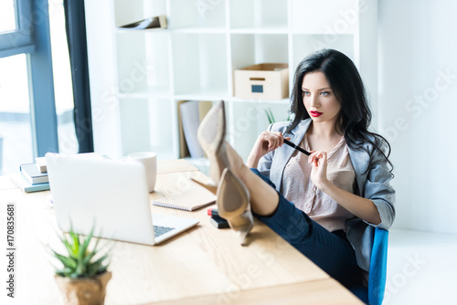 businesswoman at workplace with laptop