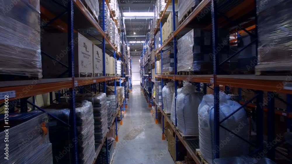 Storage warehouse. Camera cranes goes up on shelves. 4K. Storage warehouse. Camera cranes goes up on shelves. 4K.