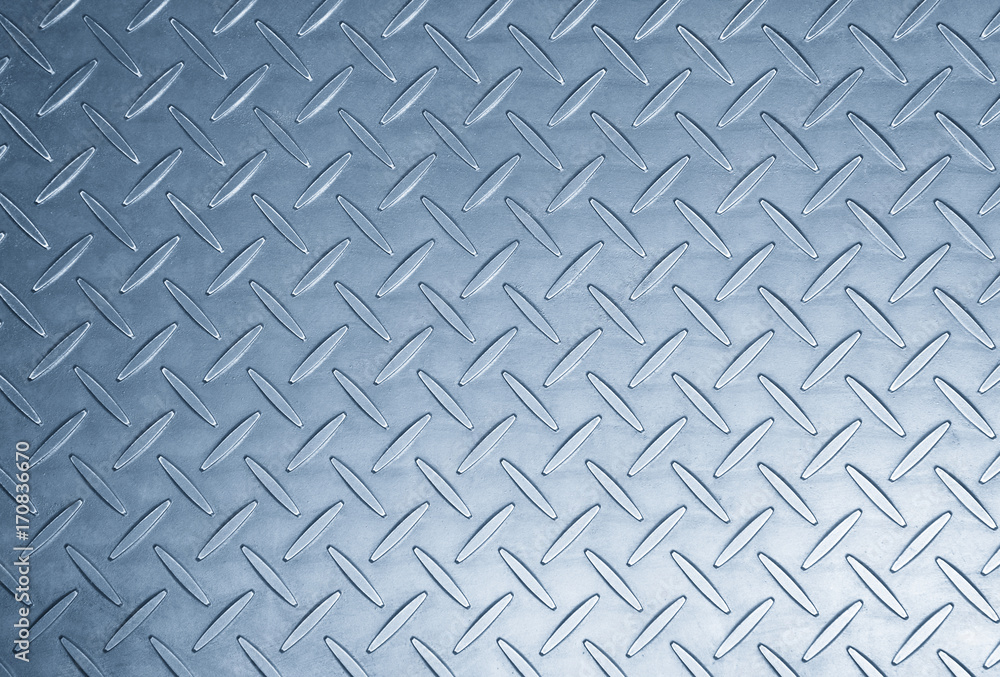The metal texture background in light blue scene.Th texture at the metal plat for anti-slip reason The metal texture background in light blue scene.Th texture at the metal plat for anti-slip reason