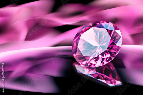 Pink diamond on reflective surface with pink blurry abstract background.