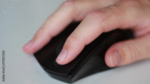 Working with black mouse closeup