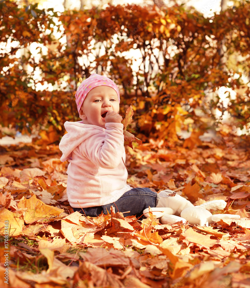 happy little child, baby girl laughing and playing in the autumn on the nature walk outdoors happy little child, baby girl laughing and playing in the autumn on the nature walk outdoors