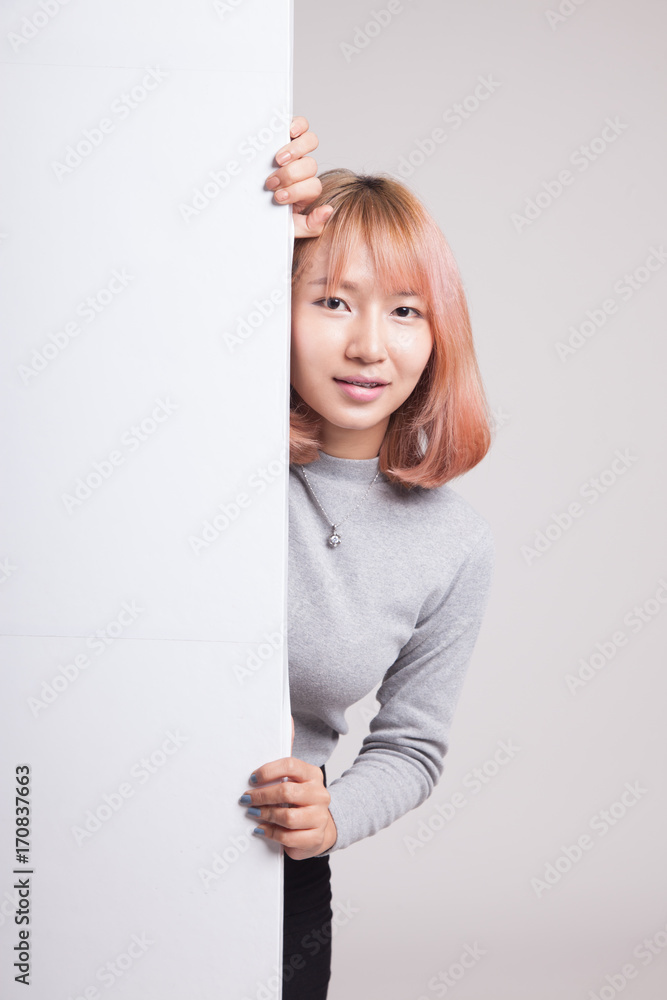 Young Asian woman with blank sign. Young Asian woman with blank sign.