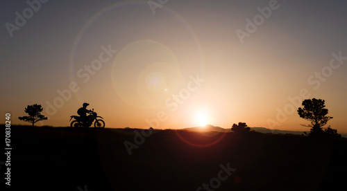 watching the sunrise at break motorcyclist