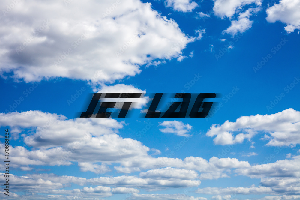 Jet lag writing on blue cloudy sky background