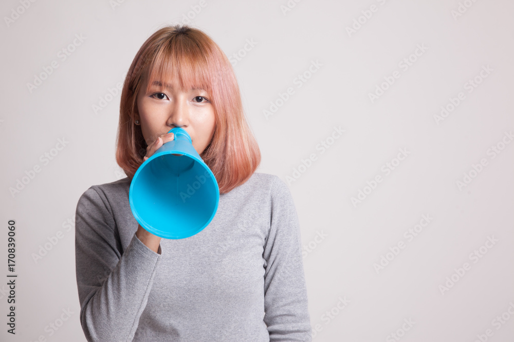 Beautiful young Asian woman announce with megaphone. Beautiful young Asian woman announce with megaphone.