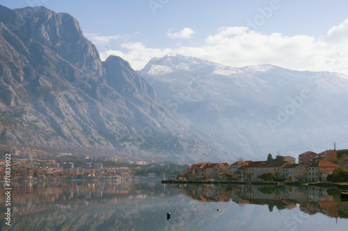 Winter day on the coast of Kotor Bay of Adriatic Sea, Montenegro. View of Lovcen mountain, town of Prcanj and town of Dobrota