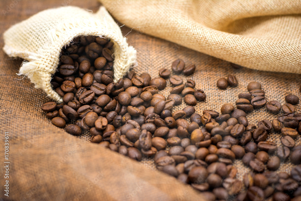 Coffee espresso and coffee cup and beans on table,Tea cup on table,warm cup of coffee on brown background, Coffee espresso and coffee cup and beans on table,Tea cup on table,warm cup of coffee on brown background,