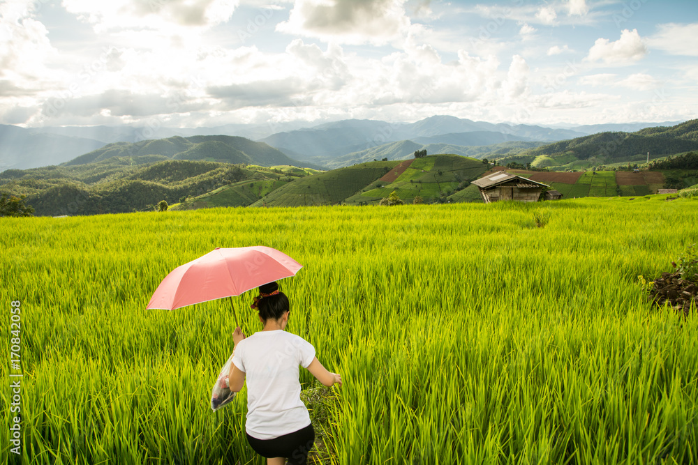 Woman relaxing in rice terraces on holiday Woman relaxing in rice terraces on holiday