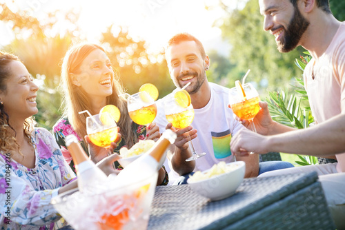 Photography Group of friends cheering with summer cocktails