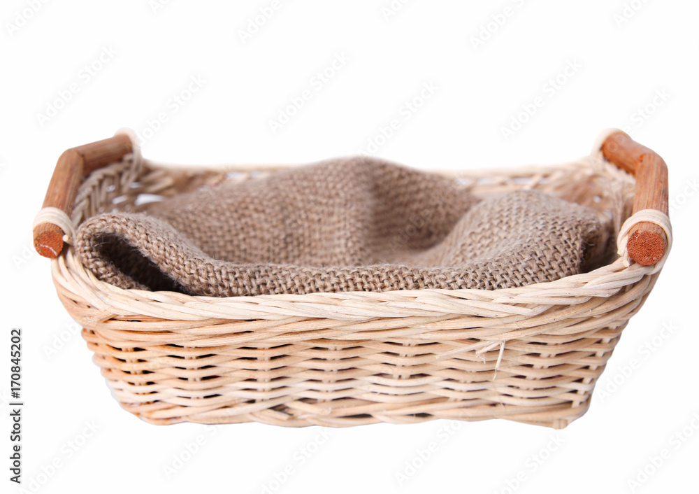 Obraz premium Empty basket with cloth isolated.