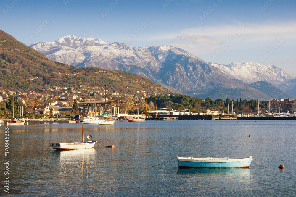 View of the snow-covered mountain Lovcen from the Bay of Kotor. Tivat town, Montenegro