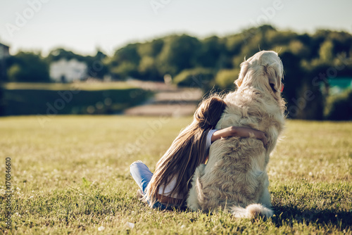 Little cute girl with dog