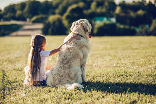 Photography Little cute girl with dog