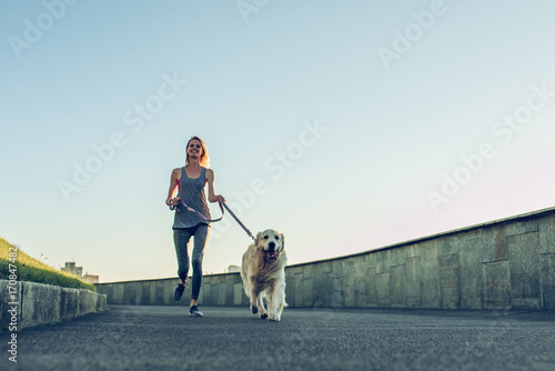 Photography Woman running with dog