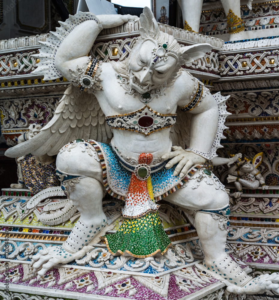 Fototapeta premium Traditional Thai style sculptures and painting of monster,animals and gods in church under decoration of Wat Pariwat