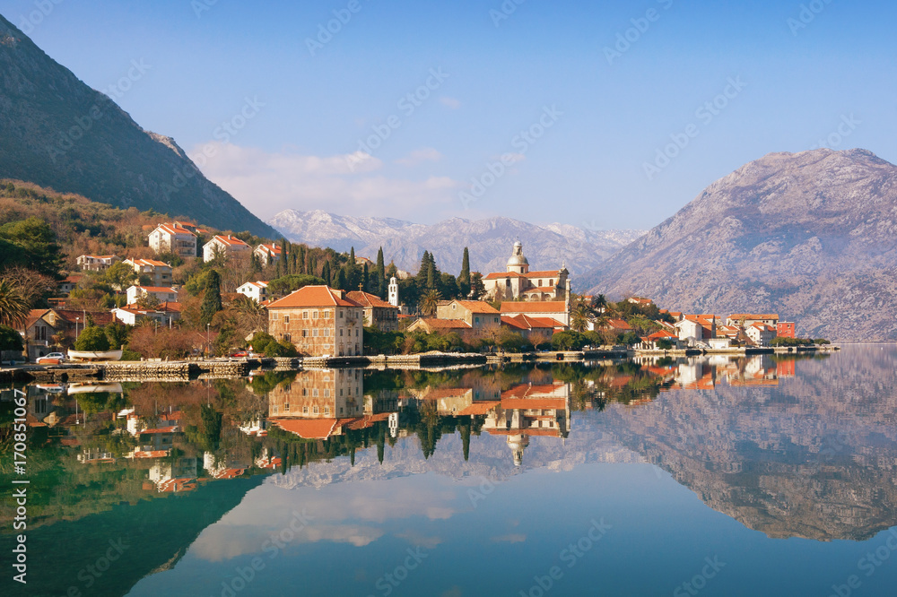 View of seaside Prcanj town on a sunny winter day. Bay of Kotor (Adriatic Sea), Montenegro