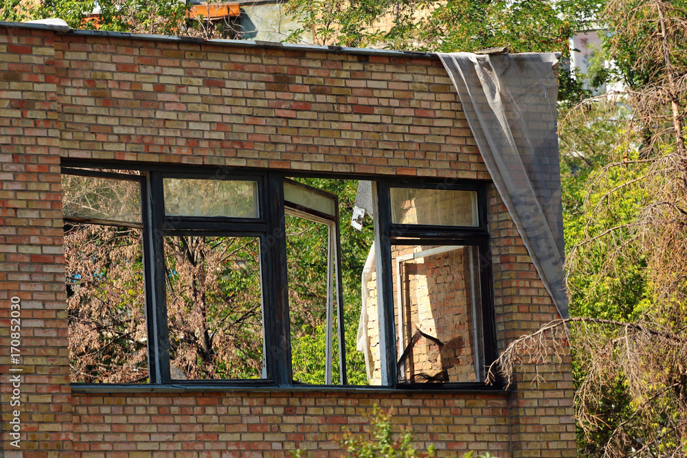 Windows in old broken brick house