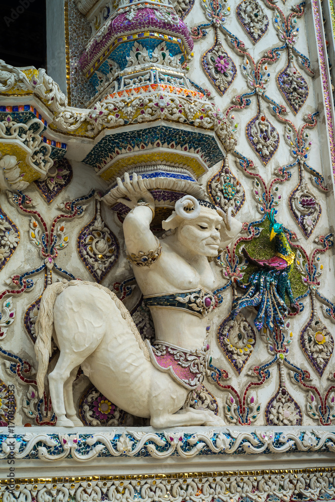 Obraz premium Traditional Thai style sculptures and painting of monster,animals and gods in church under decoration of Wat Pariwat