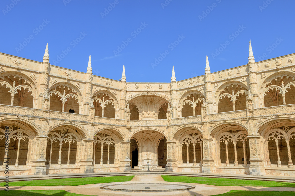 Courtyard or cloisters of Hieronymites Monastery famous Lisbon landmark in Belem district and Unesco Heritage. The Mosteiro dos Jeronimos celebrates the return of Portuguese navigator Vasco da Gama.