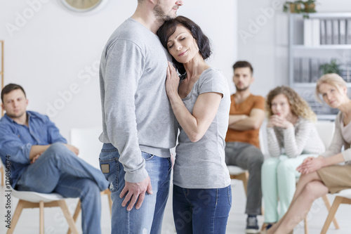 Woman embracing man during therapy