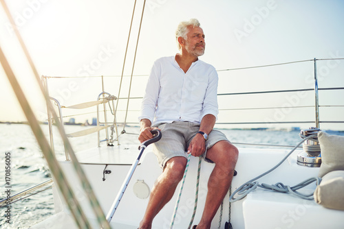 Mature man out for a sail on the ocean