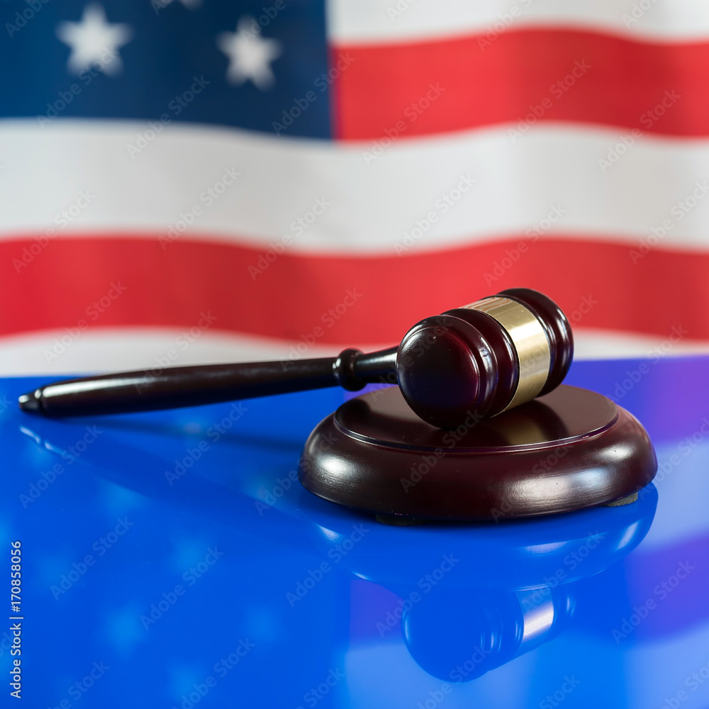 Law and justice symbols on American flag background. Law and justice symbols on American flag background.