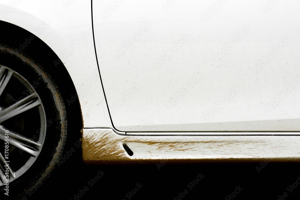 splashes of mud from wheel on a white car splashes of mud from wheel on a white car