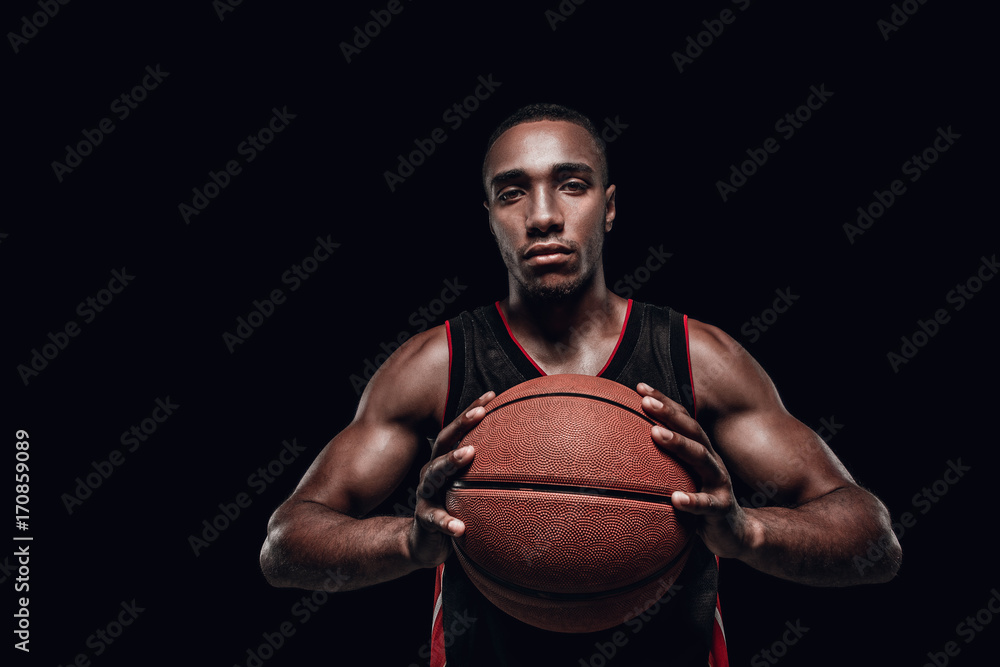 The portrait of a basketball player with ball The portrait of a basketball player with ball