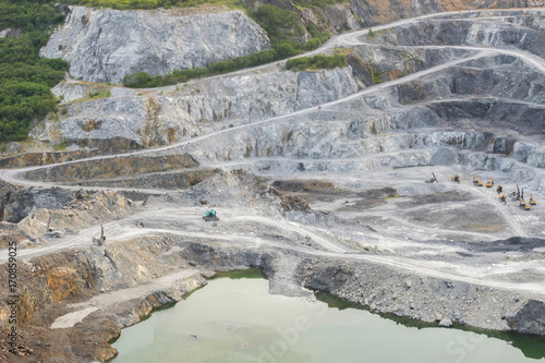 The tracked excavators are operating in the stone quarry.