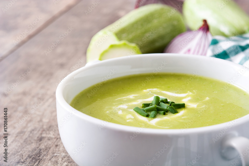 zucchini soup in bowl on wooden table zucchini soup in bowl on wooden table