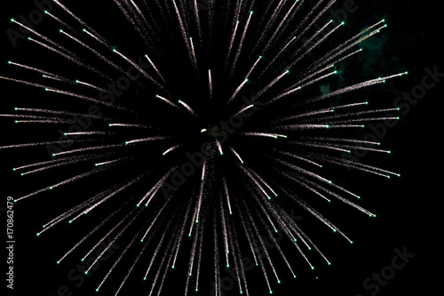 beautiful and colorful fireworks explossion over black sky background