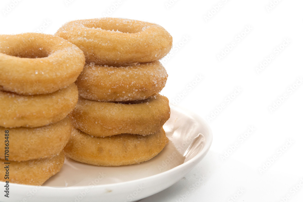 Fried Donuts with sugar topping isolated on white Fried Donuts with sugar topping isolated on white