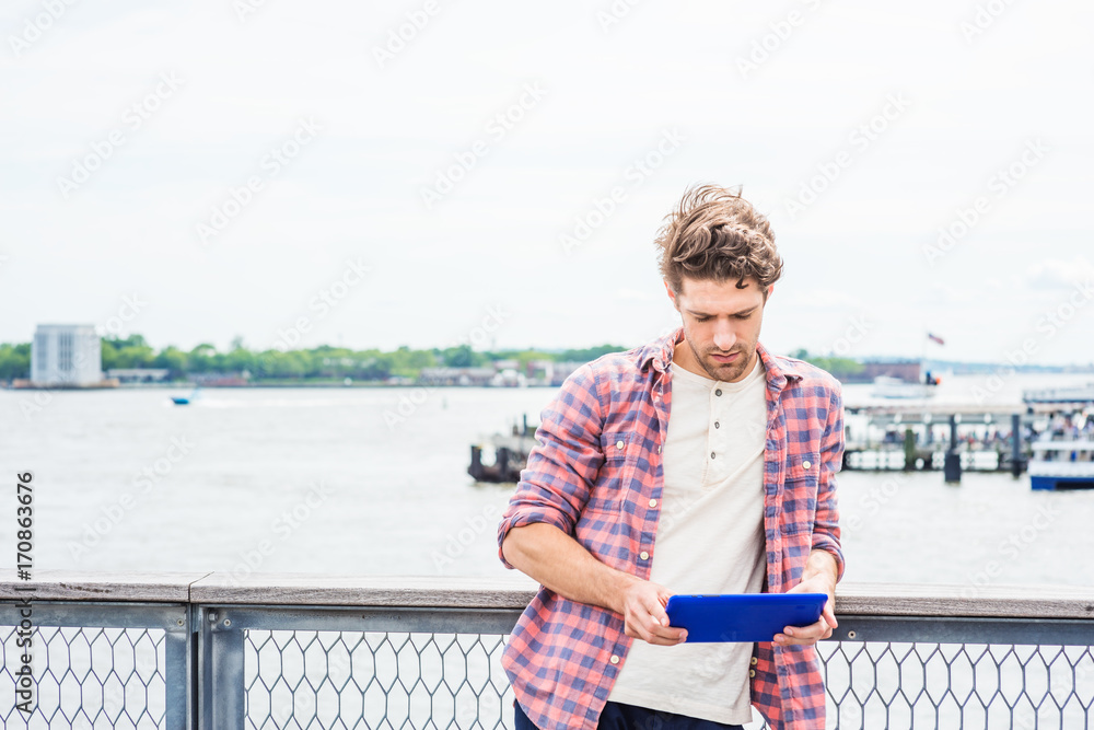 Fototapeta premium Young American man traveling, relaxing in New York