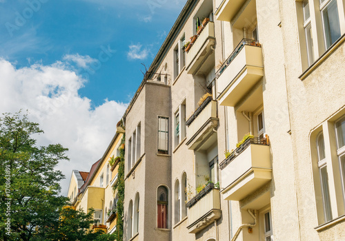 yellow apartment buildings in summer