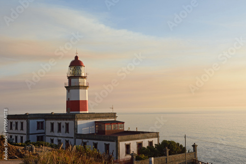 Sunset at lighthouse of Cape Sillerio, Pontevedra province, Galia, Spain photo