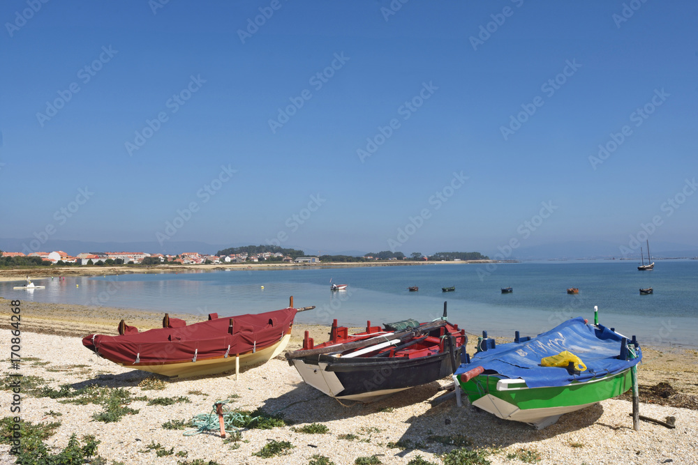 Arousa Island boats on the beach Praia Boa Norte, Pontevedra province, Galicia, Spain
