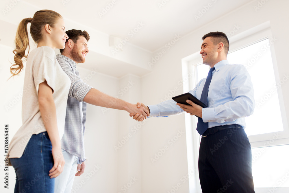 man and realtor shaking hands at new home man and realtor shaking hands at new home