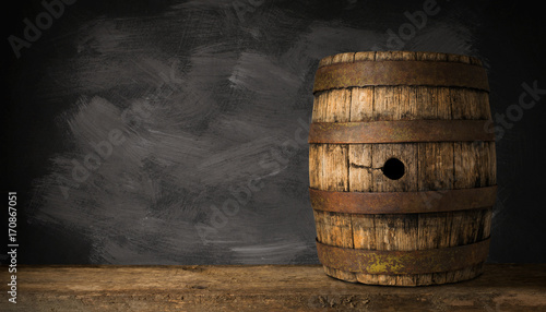 Old Wooden Beer Barrel on the Dark Background